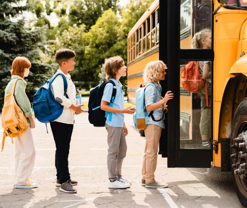 Children boarding a school bus